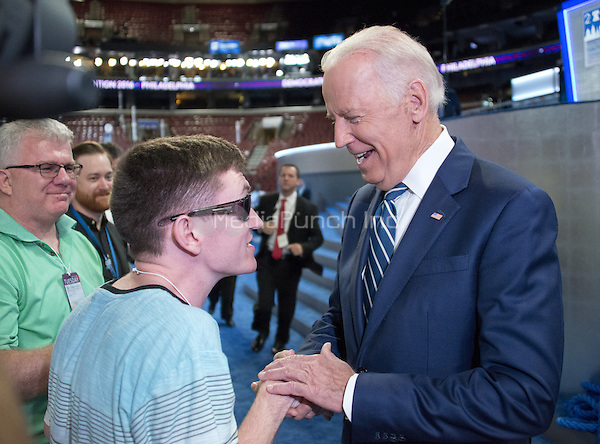 United States Vice President Joe Biden greets Timmy Kelly, 23, of Philadelphia, Pennsylvania who was born blind and with cerebral palsy will sing the National Anthem to open the second day of the 2016 Democratic National Convention held at the Wells Fargo Center in Philadelphia, Pennsylvania on Tuesday, July 26, 2016. Timmy, a senior music major at Temple University is known as the Eagles' "good luck charm" because of their win record when he sings before their games.<br />
Credit: Ron Sachs / CNP/MediaPunch<br />
(RESTRICTION: NO New York or New Jersey Newspapers or newspapers within a 75 mile radius of New York City)