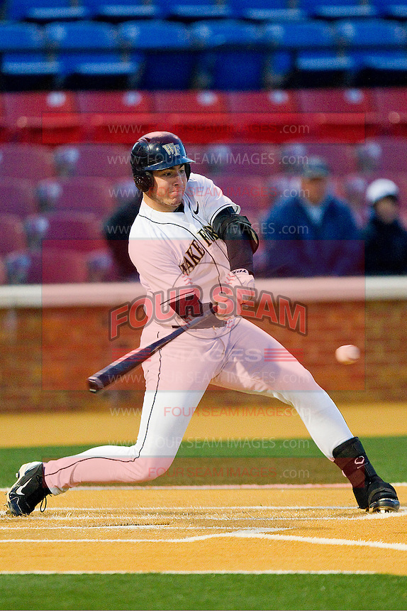 Matt Conway #25 of the Wake Forest Demon Deacons takes his swings against the North Carolina Tar Heels at Gene Hooks Field on March 11, 2011 in Winston-Salem, North Carolina. Photo by Brian Westerholt / Four Seam Images