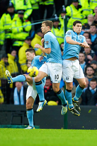 09.12.2012 Manchester, England. Manchester City's free-kick wall of Samir Nasri, Edin Dzeko and Gareth Barry ar beaten for the winning goal shot from Van Persie during the Premier League game between Manchester City and Manchester United from the Etihad Stadium. Manchester United scored a late winner to take the game 2-3.