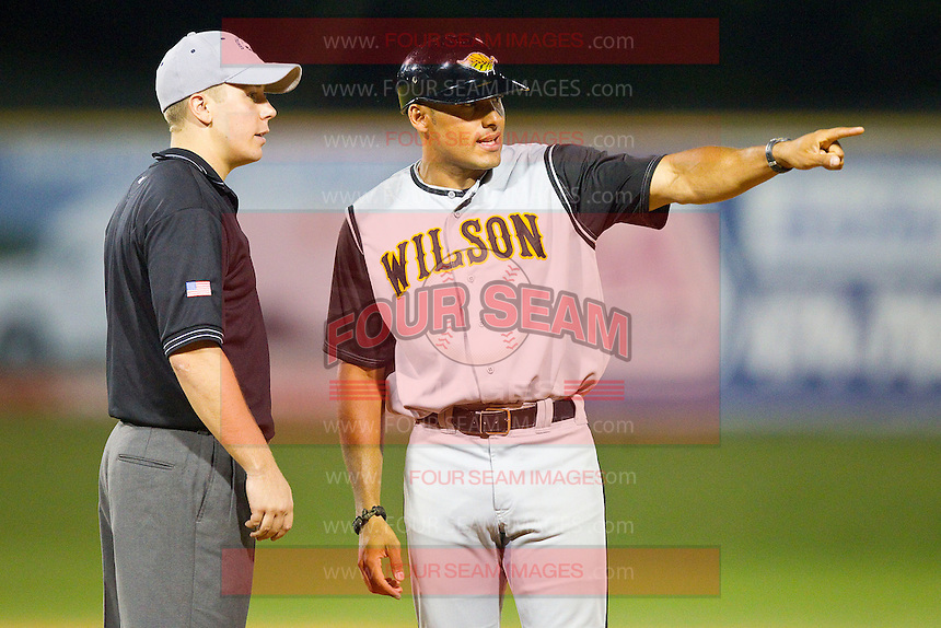 Wilson Tobs manager Austin Love (NC A&T) pleads his case with base umpire Matt Carlyon during the Coastal Plain League game against the High Point-Thomasville HiToms at Finch Field on June 17, 2013 in Thomasville, North Carolina. The Tobs defeated the HiToms 3-2 in 11 innings. Brian Westerholt/Four Seam Images