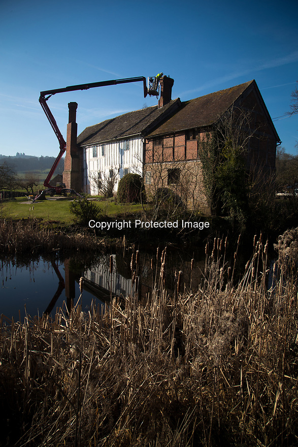15/02/19<br />
<br />
**Free photo for editorial use**<br />
<br />
New pots are fixed to the chimneys at Lower Brockhampton the National Trust's 14th century in Herefordshire.<br />
<br />
All Rights Reserved, F Stop Press Ltd. (0)7765 242650 www.fstoppress.com rod@fstoppress.com