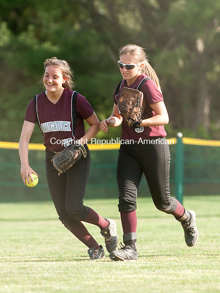 WATERTOWN, CT-11 May 2015-051115EC07- Naugatuck's Tabitha Genovese (5) and Erica Andreoli (9) run off the field after a Watertown ball is caught by Andreoli in the outfield Monday. Erin Covey Republican-American