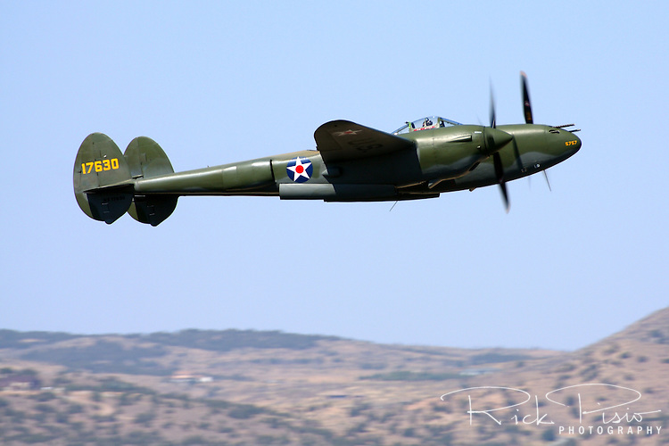 Glacier Girl, a P-38 Lightning, takes to the skies over Stead Field in Nevada to participate in the Air Force Heritage Flight during the 2008 Reno Air Races. In July of 1942 the aircraft was forced to make an emergency landing in Greenland while en-route to the British Isles. Five other p-38's and 2 B-17 bombers where eventually buried beneath 270 feet of ice. In 1992 Glacier Girl was brought to the surface and transported to Middlesboro, Kentucky, for restoration to flying condition. On October 26, 2002 Steve Hinton took Glacier Girl into the air for the first time in over 60 years.