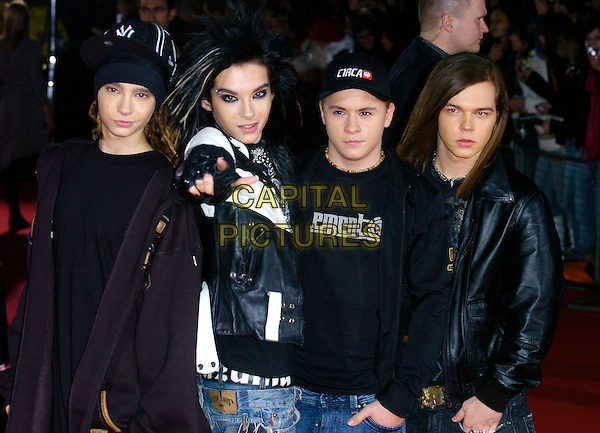 TOKIO HOTEL.Arrivals at World Music Awards 2006, Earls Court, London, UK..November 15th, 2006.half length Bill Kaulitz Tom Gustav Schafer Georg Listing black leather jacket pointing Tokyo.CAP/CAN.©Can Nguyen/Capital Pictures