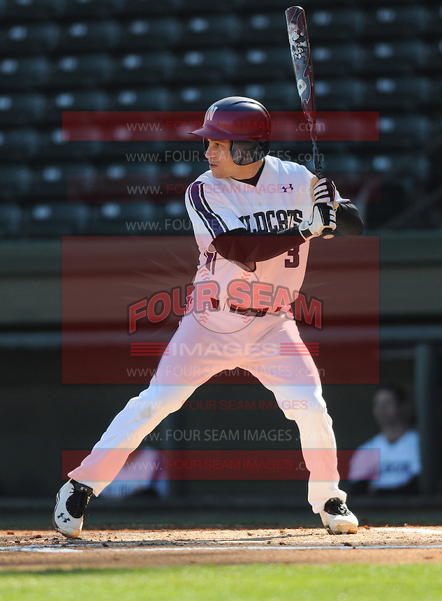 Shortstop Trevor Stevens (3) of the Northwestern Wildcats hits in a game against the Michigan State Spartans on Sunday, February 17, 2013, at Fluor Field at the West End in Greenville, South Carolina. Michigan State won, 7-4. (Tom Priddy/Four Seam Images)