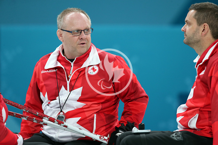Pyeongchang, Korea, 15/3/2018-Mark Ideson and Dennis Thiessen compete in the wheelchair curling during the 2018 Paralympic Games in PyeongChang. Photo Scott Grant/Canadian Paralympic Committee.