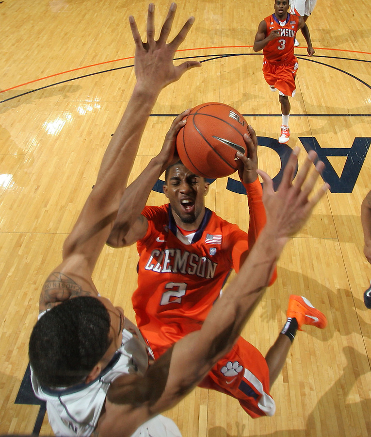 Feb. 2, 2011; Charlottesville, VA, USA; Clemson Tigers guard Demontez Stitt (2) is defended by Virginia Cavaliers guard Jontel Evans (1) during the game at the John Paul Jones Arena. Virginia won 49-47. Mandatory Credit: Andrew Shurtleff