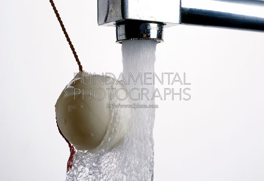 BERNOULLI'S PRINCIPLE: BALL IN STREAM OF WATER<br />
(Variations Available)<br />
Ping Pong Ball Attracted to Stream of Water<br />
Bernoulli's principle shows that the flow of water lowers the air pressure on the right side of the ball. The higher pressure on the left pushes it into the stream of water. The ball stays in the stream of water even as the string is pulled.
