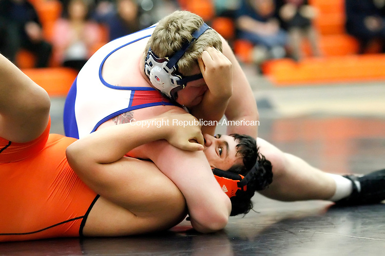 Terryville, CT- 17 January 2013-011713CM10- Nonnewaug's Josh Zitnay (top) wraps up Terryville's Theo Ridgeway in the 285 weight class during Berkshire League wrestling action Thursday night in Terryville. Zitnay pinned Ridgeway for the win. Christopher Massa Republican-American