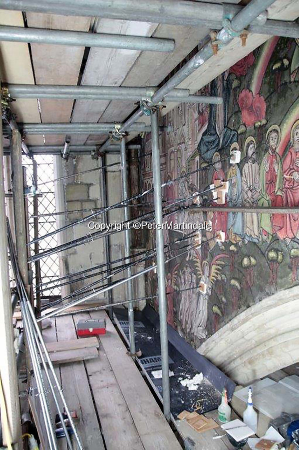 BNPS.co.uk (01202 558833)<br />
Pic: PeterMartindale/BNPS<br />
<br />
Part of a major £1.5 million conservation scheme...<br />
<br />
Doom finally has its day! - A 500 year old 'Day of Judgement’ painting, that has survived Henry VIII th, the Puritans and even Victorian prudery has been restored to its former glory.<br />
<br />
Thought to be the largest medieval 'Doom' painting in the country, the striking image been painstakingly restored after a tumultuous 500 year history on the chancel arch of St Thomas Becket church in Salisbury.<br />
<br />
Originally painted in the 15th century, the chancel was white-washed during the Reformation before being uncovered nearly 300 years later in the early 19th century. <br />
<br />
Prudish Victorian's shocked by the naked images then recovered it before it finally re-emerged in 1881 as opinions relaxed. <br />
<br />
Experts have spent three months conserving the faded painting, which included injecting lime slurry behind areas of paint to affix them again to the wall. and delicately 'touching up' in places before finishing it with varnish to bring out its colour.<br />
<br />
Most pre 16th century churches and cathedrals in Britain would have been plastered with religious images and iconography to encourage their often illiterate congregation to good behaviour.<br />
<br />
But during Henry VIII th Protestant Reformation churches were stripped of all graven imagery and the paintings were either whitewashed over or completely destroyed.<br />
<br />
Because of this very few works still survive today making the Salisbury fresco a truly remarkable survivor.<br />
<br />
The restoration is part of a larger set of works at the historic church which are due to cost £1.5million.