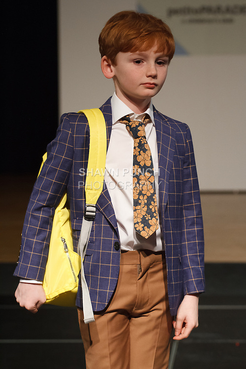 Model walks runway in an outfit by TO Collection, during the petitePARADE Children's Club fashion show at the Jacob Javits Center in New York City, on January 9, 2016.