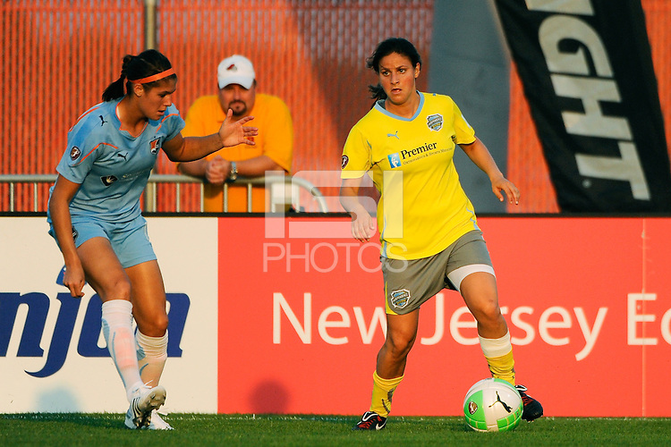 Tina DiMartino (25) of the Philadelphia Independence is marked by Brittany Taylor (14) of Sky Blue FC. The Philadelphia Independence defeated Sky Blue FC 4-1 during a Women's Professional Soccer (WPS) match at Yurcak Field in Piscataway, NJ, on June 19, 2010.
