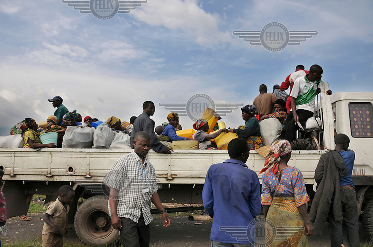Displaced people prepare to leave the Kibati IDP (Internally Displaced Persons) camp and return to their homes.