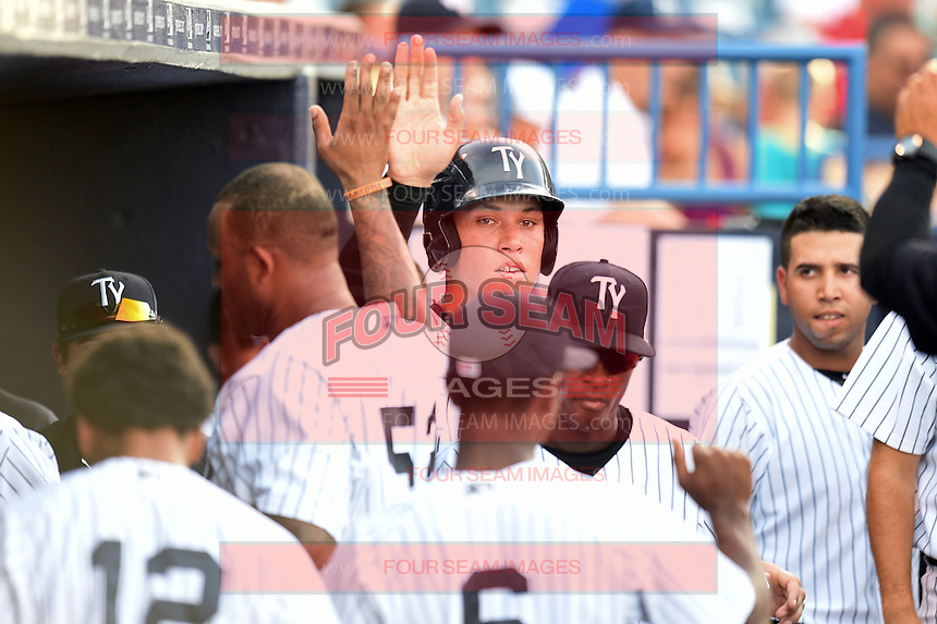 Tampa Yankees outfielder Aaron Judge (59) high fives CC Sabathia (52) after scoring a run during a game against the Dunedin Blue Jays on June 28, 2014 at George M. Steinbrenner Field in Tampa, Florida. Tampa defeated Dunedin 5-2. (Mike Janes/Four Seam Images)