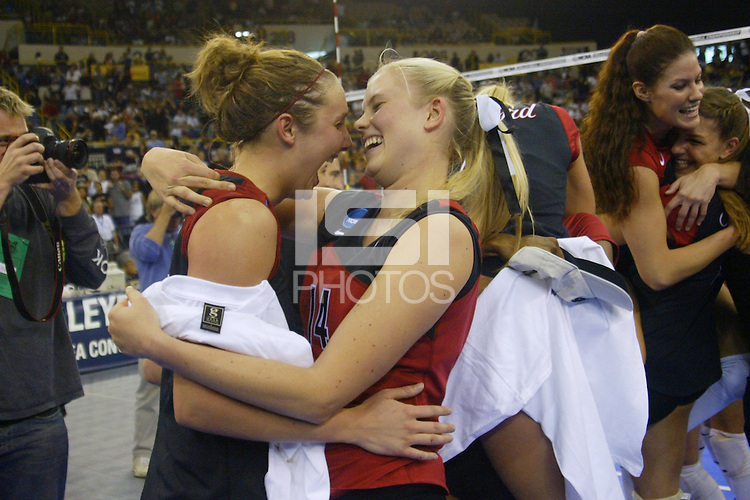 18 December 2004: Stanford Cardinal Courtney Schultz with Kristin Richards during Stanford's 30-23, 30-27, 30-21 victory over Minnesota in the 2004 NCAA Women's Volleyball National Championships in Long Beach, CA. Stanford won their sixth women's volleyball title in school history. Jennifer Hucke and Liz Suiter in the backround.<br />
Photo credit mandatory: David Gonzales