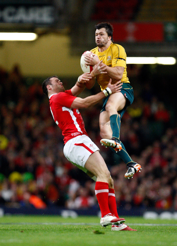 Photo: Richard Lane/Richard Lane Photography. Wales v Australia. Autumn International. 03/12/2011. Australia's Adam Ashley-Cooper wins a high ball as Wales' Jamie Roberts challenges.