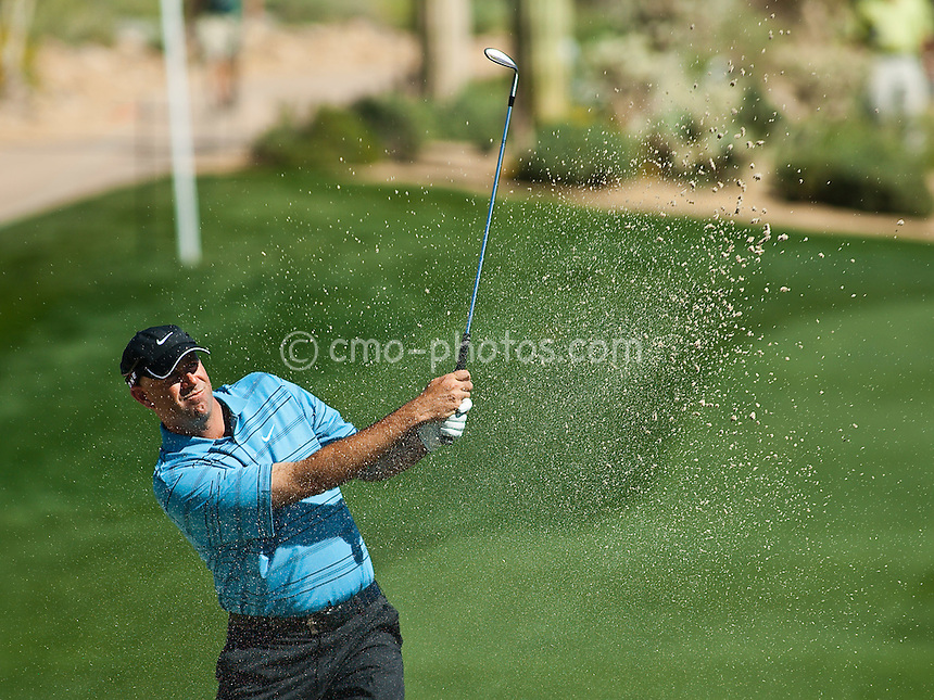 Mar 1, 2009; Marana, AZ, USA; Stewart Cink (USA) hits out of the bunker on the 11th hole during the final round consolation match of the World Golf Championships-Accenture Match Play Championship at the Ritz-Carlton Golf Club, Dove Mountain.