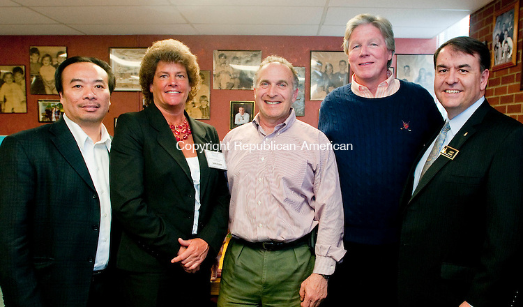 WATERBURY, CT, 05 APRIL 2011-040511JS04--Trung Le, Program Supervisor for the State of Connecticut Department of Children and Families, Kelly Cronin Executive Director of Waterbury Youth Service, Mark Greenberg, Tom Coughlin, former owner of the building which now houses Waterbury Youth Service and John DiBiaso, Waterbury Youth Service board president at the open house for the new building for Waterbury Youth Service. <br />
Jim Shannon/Republican-American