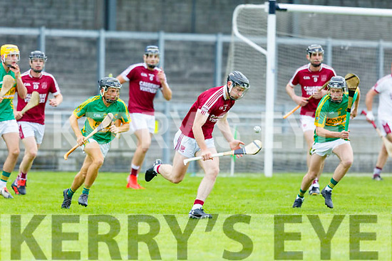 Causeway's Bryan Murphy clears his defence despite the pressure from Lixnaws Shane Conway and Robert Silles in R2 of the Garvey Supervalu Hurling Championship on Sunday