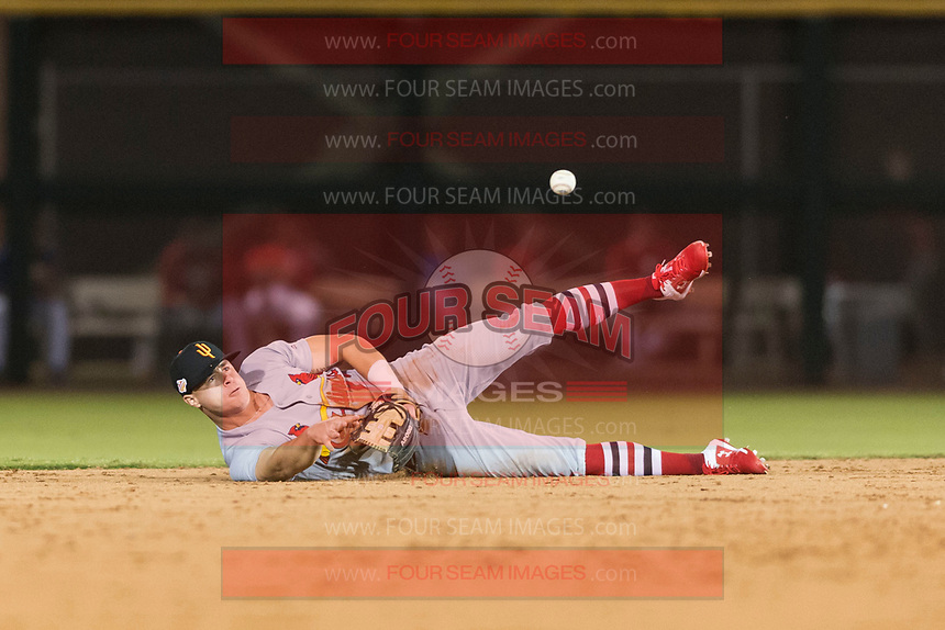 Surprise Saguaros second baseman Andy Young (29), of the St. Louis Cardinals organization, flips the ball to Cole Tucker (not pictured) after making a diving play during an Arizona Fall League game against the Scottsdale Scorpions at Scottsdale Stadium on October 15, 2018 in Scottsdale, Arizona. Surprise defeated Scottsdale 2-0. (Zachary Lucy/Four Seam Images)