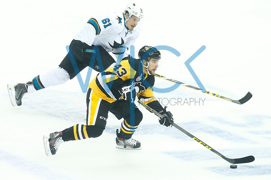 Conor Sheary #43 of the Pittsburgh Penguins races down the ice with the puck past Justin Braun #61 of the San Jose Sharks in the first period during game two of the Stanley Cup Final at Consol Energy Center in Pittsburgh, Pennslyvania on June 1, 2016. (Photo by Jared Wickerham / DKPS)
