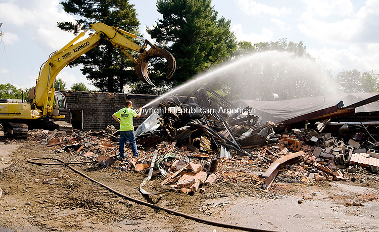 WINSTED, CT-080317JS03-- Workers from Bestech Environmental Services and Demolition, demolished the old Joyner Learning Center building at Northwestern Connecticut Community College in Winsted on Thursday. The demolition, which is expected to take two weeks, is to clear the way for parking for the newly built Joyner Center build right next to the old building. <br />
Jim Shannon Republican-American