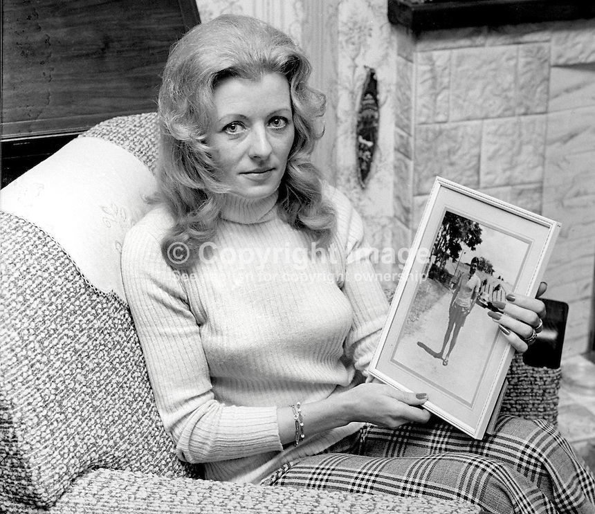 Mrs Ina Vines, widow of ATO, Army Technical Officer, Sgt Major William Ronald Vines, who died in a Provisional IRA landmine explosion near Crossmaglen, Co Armagh, N Ireland, on 5th May 1973. She is show with a framed photograph of her husband.Two other soldiers died when a second landmine exploded during a follow-up operation. 197504170374a<br />
<br />
Copyright Image from Victor Patterson, 54 Dorchester Park, Belfast, UK, BT9 6RJ<br />
<br />
Tel: +44 28 9066 1296<br />
Mob: +44 7802 353836<br />
Voicemail +44 20 8816 7153<br />
Email: victorpatterson@me.com<br />
Email: victorpatterson@gmail.com<br />
<br />
IMPORTANT: My Terms and Conditions of Business are at www.victorpatterson.com