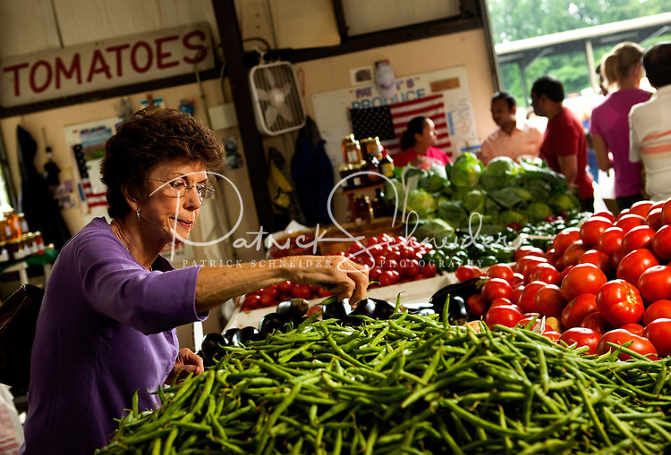 Shoppers look for farm-fresh fruits and vegetables at the Charlotte Regional Farmers Market, one of five farmers markets owned by the state of North Carolina and operated by the NC Department of Agriculture and Consumer Services (NCDA&CS). The year-round market, located at 1801 Yorkmont Road, Charlotte, NC, sells everything from fresh produce to fresh pork and beef, ostrich, emu, baked goods, jams, jellies, crafts, plants and more.
