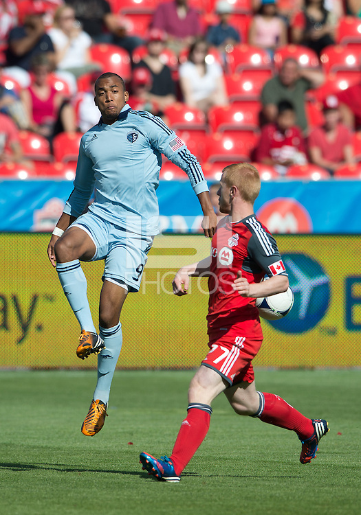 August 18, 2012: Sporting KC forward Teal Bunbury #9 and Toronto FC defender Richard Eckersley #27 in action during an MLS game between Toronto FC and Sporting Kansas City at BMO Field in Toronto, Ontario Canada..Sporting Kansas City won 1-0.