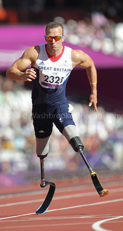 Paralympics London 2012 - ParalympicsGB - Athletics Men's 100m - T42 Round 1 held at the Olympic Stadium 7th September 2012..Richard Whitehead competing in the Men's 100m - T42 Round 1 held at the Olympic Stadium 7th September 2012 at the Paralympic Games in London. Photo: Richard Washbrooke/ParalympicsGB