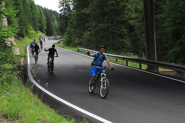 Cyclists in the Dolomites, Canazei, Italy, Europe. . John offers private photo tours in Denver, Boulder and throughout Colorado, USA. Year-round. . John offers private photo tours in Denver, Boulder and throughout Colorado. Year-round.