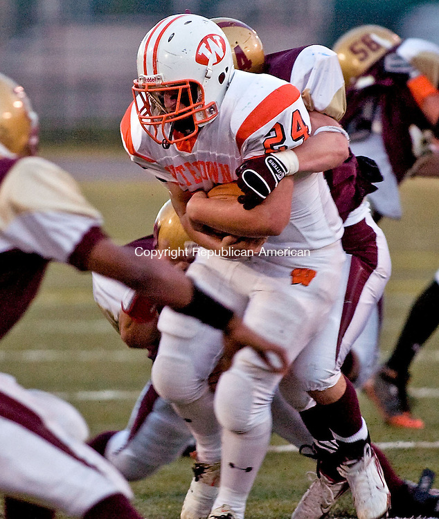 WATERBURY, CT - 16 OCTOBER 2008 -101608JT08--<br />
Watertown's Chris Corbo gets tackled by Sacred Heart's Matt Murphy during Thursday's game at Municipal Stadium in Waterbury. Watertown won 41-13.<br />
Josalee Thrift / Republican-American