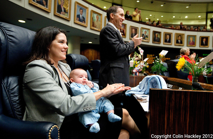 TALLAHASSEE, FLA. 1/10/12-OPENING011012 CH-Sen. Anitere Flores, R-Miami, holds her son Lucas Ignacio Anderson, age 2 1/2 months, during the opening day of the 2012 legislative session at the Capitol in Tallahassee..COLIN HACKLEY PHOTO
