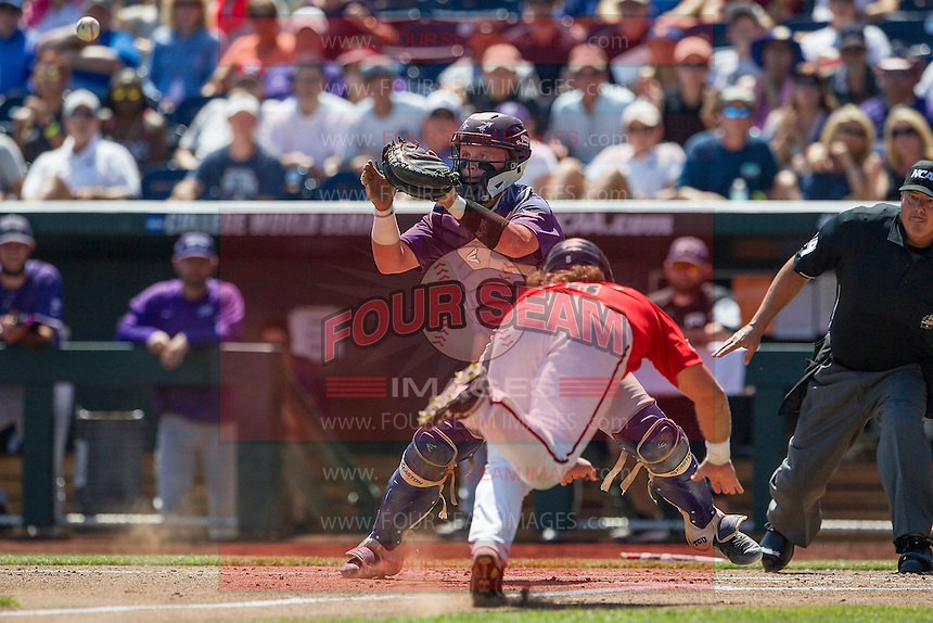 TCU Horned Frogs catcher Evan Skoug (9) waits for a throw at the plate as Texas Tech Red Raiders baserunner Tanner Gardner (8) slides safely home during Game 3 of the NCAA College World Series on June 19, 2016 at TD Ameritrade Park in Omaha, Nebraska. TCU defeated Texas Tech 5-3. (Andrew Woolley/Four Seam Images)