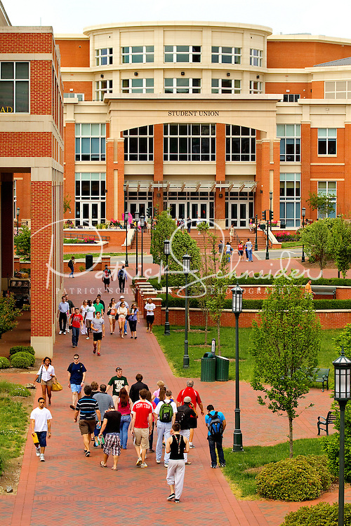 Photography of Charlotte NC's University of North Carolina at Charlotte campus (UNC Charlotte). UNCC, a public university located in northeast Charlotte, is part of the University of North Carolina higher education system. Opened in 1946, the campus has experienced explosive growth in recent years, including the addition of its Charlotte Research Institute campus and a football team. Photo shows the UNCC Student Union Building.