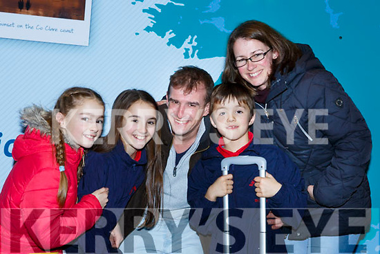 Maeve, Maddie and Dominick Courtney Waterville give their uncle Greg Wright a huge hug with their mum Miriam after he returned home from London for Christmas at Kerry Airport on Monday