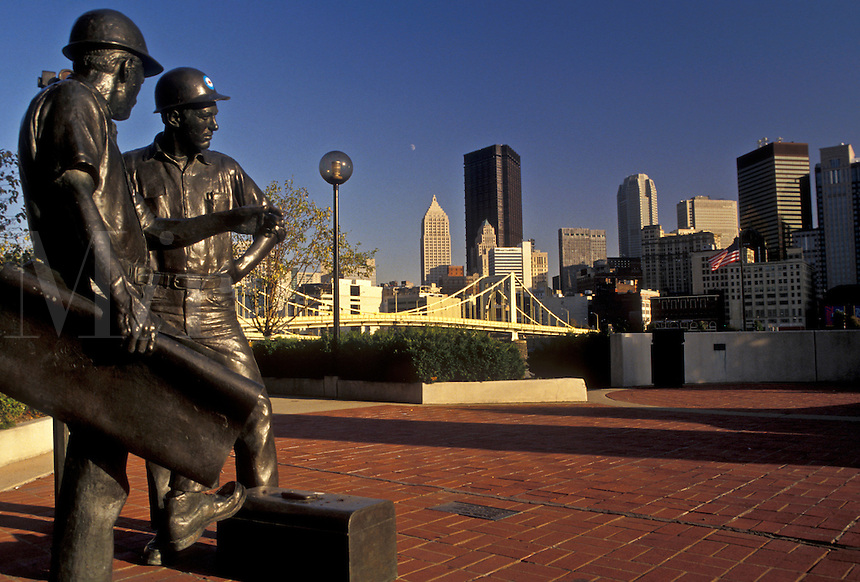 AJ3198, Pittsburgh, Pennsylvania, Mining statue at Allegheny Landing with a view of the downtown skyline of Pittsburgh in the background in the state of Pennsylvania.