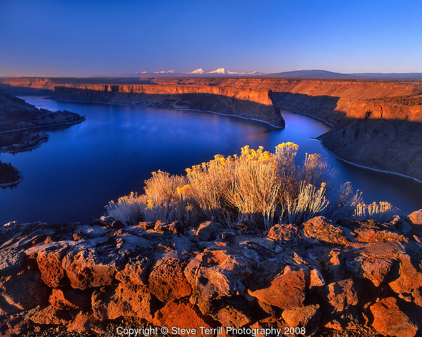 Lake Billy Chinook at sunrise with the Three Sisters on horizon in central Oregon
