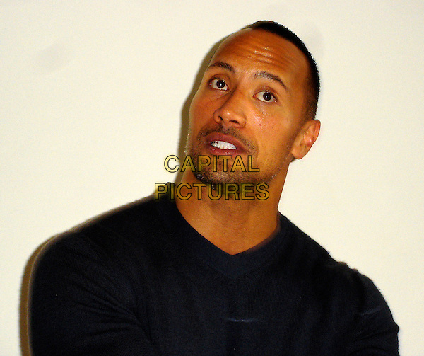 DWAYNE "THE ROCK" JOHNSON.Photocall for "Race to Witch Mountain", Four Seasons, Burton Room, Los Angeles, California, USA..March 11th, 2009 .headshot portrait black top stubble facial hair .CAP/AW.©Anita Weber/Capital Pictures.