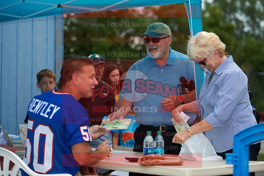 Former Buffalo Bills linebacker Ray Bentley signs autographs before a Batavia Muckdogs game against the West Virginia Black Bears on August 21, 2016 at Dwyer Stadium in Batavia, New York. West Virginia defeated Batavia 6-5. (Mike Janes/Four Seam Images)