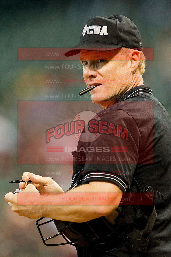 Home plate umpire Danny Mascorro updates his lineup card during the game between the Texas Longhorns and the Tennessee Volunteers at Minute Maid Park on March 3, 2012 in Houston, Texas. The Volunteers defeated the Longhorns 5-4. (Brian Westerholt/Four Seam Images)