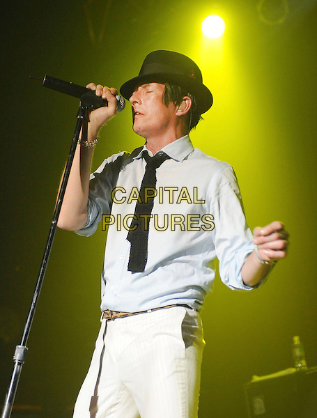 SCOTT WEILAND.performs live during his solo tour at HOB Anaheim in Anaheim, California, USA, May 23rd 2009..music concert gig show on stage performing half length black hat fedora shirt tie white trousers microphone singing .CAP/DVS.©Debbie VanStory/RockinExposures/Capital Pictures