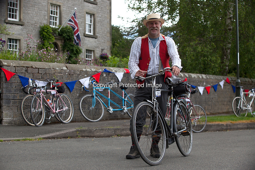 2106/15<br />
<br />
A rider stops for a beer in Harrington.<br />
<br />
Three Thousand cyclists riding vintage machines, all older than 1987, take to the hills of the Peak District in Derbyshire, as part of the Eroica Britannia Festival held in Bakewell this weekend.<br />
<br />
All Rights Reserved: F Stop Press Ltd. +44(0)1335 418629 www.fstoppress.com.