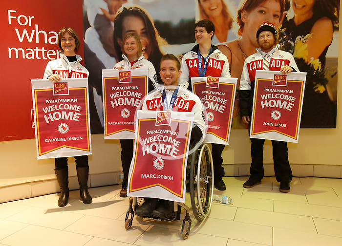 Ottawa, ON - March 28 2014 - Ottawa’s Sochi Paralympians after receiving their CIBC Welcome Home banners – back row: Caroline Bisson (para-Nordic skiing and biathlon), Margarita Gorbounova (para-Nordic skiing and biathlon), bronze medallist Ben Delaney (sledge hockey), John Leslie (para-snowboard). Front: Bronze medallist Marc Dorion (sledge hockey)(Photo: Patrick Doyle/CIBC)
