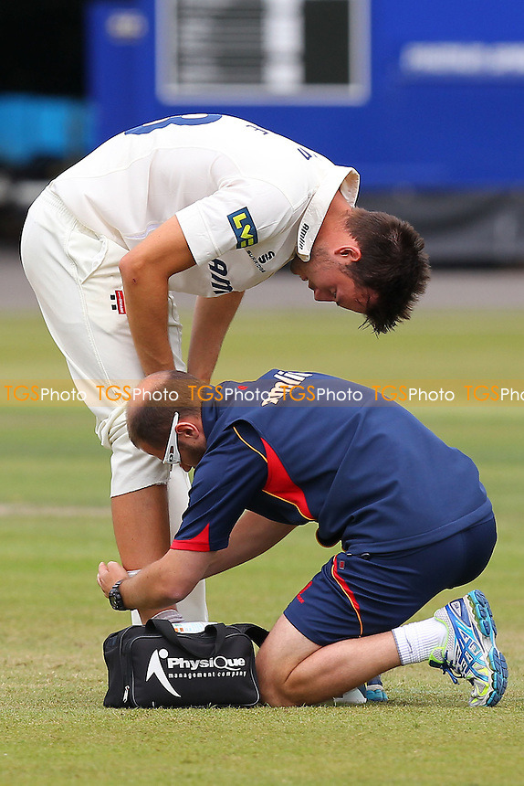 Tom Moore of Essex receives treatment for an injury to his leg - Derbyshire CCC vs Essex CCC - LV County Championship Division Two Cricket at Queen's Park, Chesterfield - 09/07/14 - MANDATORY CREDIT: Gavin Ellis/TGSPHOTO - Self billing applies where appropriate - 0845 094 6026 - contact@tgsphoto.co.uk - NO UNPAID USE