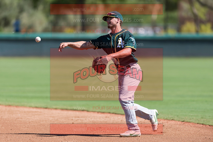 Oakland Athletics second baseman Jeremy Eierman (10) throws to first base during an Instructional League game against the Los Angeles Dodgers at Camelback Ranch on September 27, 2018 in Glendale, Arizona. (Zachary Lucy/Four Seam Images)
