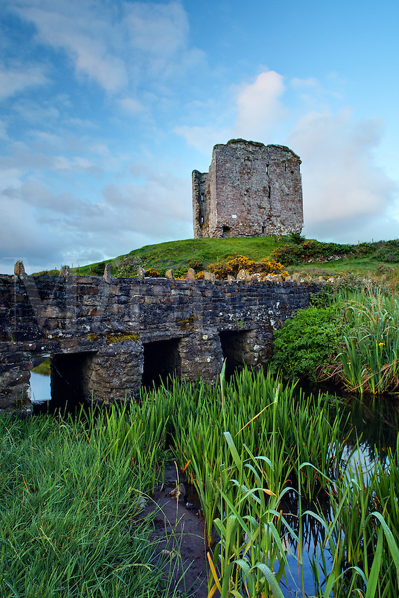 Minard Castle above sandstone bridge over small creek, Dingle Peninsula, County Kerry, Republic of Ireland