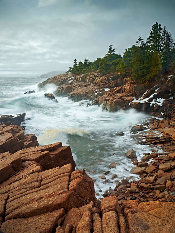 Waves crashed into the granite coastline along Ocean Drive near Newport Cove in Acadia National Park, Maine, USA