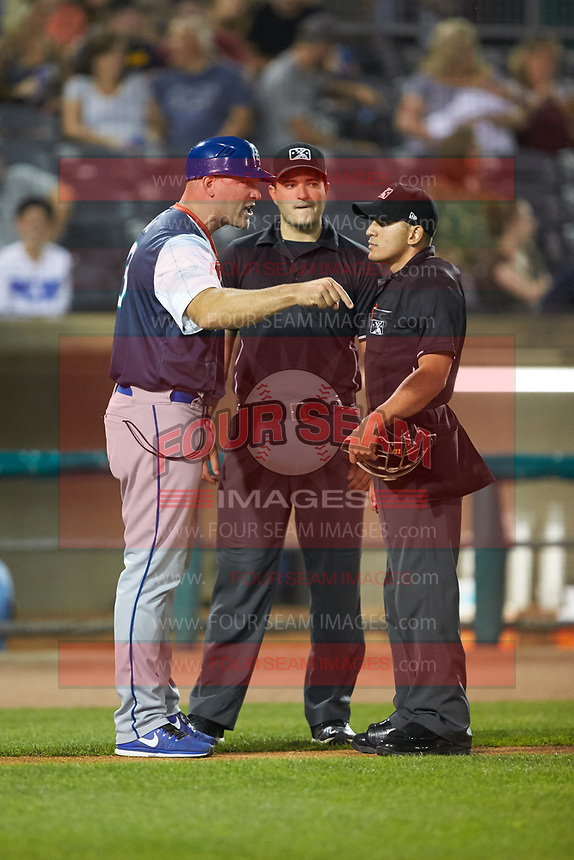 Lexington Legends manager Scott Thorman (35) argues a call with home plate umpire Kelvis Velez (right) and base umpire Ben Fernandez during the game against the West Virginia Power at Appalachian Power Park on June 7, 2018 in Charleston, West Virginia. The Power defeated the Legends 5-1. (Brian Westerholt/Four Seam Images)
