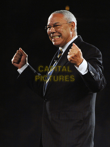 GENERAL COLIN POWELL.Former Secretary of State General COLIN POWELL speaks to a sold out crowd at the "Get Motivated!" seminar held at the Mellon Arena, Pittsburgh, Pennsylvania, USA. .August 11th, 2009 .half length hands fists black suit glasses gesture jacket smiling side view .CAP/ADM/JN.©Jason L Nelson/AdMedia/Capital Pictures.